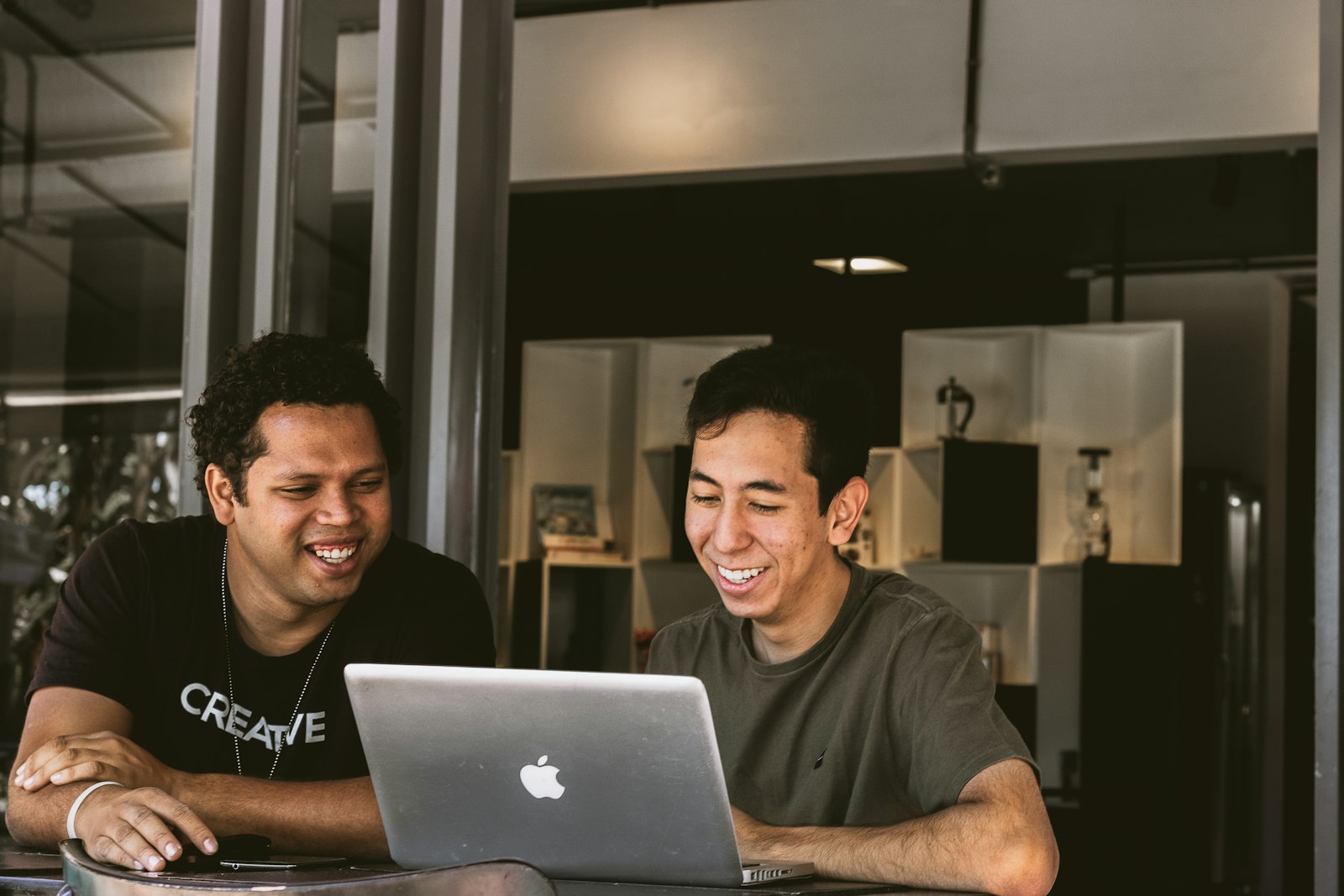 Cofounder desk — Two founders reviewing the roadmap together